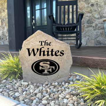 Decorative San Francisco 49ers Name Stone featuring personalized family names permanently engraved into the stone surface alongside officially licensed team graphics. Perfect for gardens, patios, and entryways, this outdoor accent celebrates 49ers football tradition.