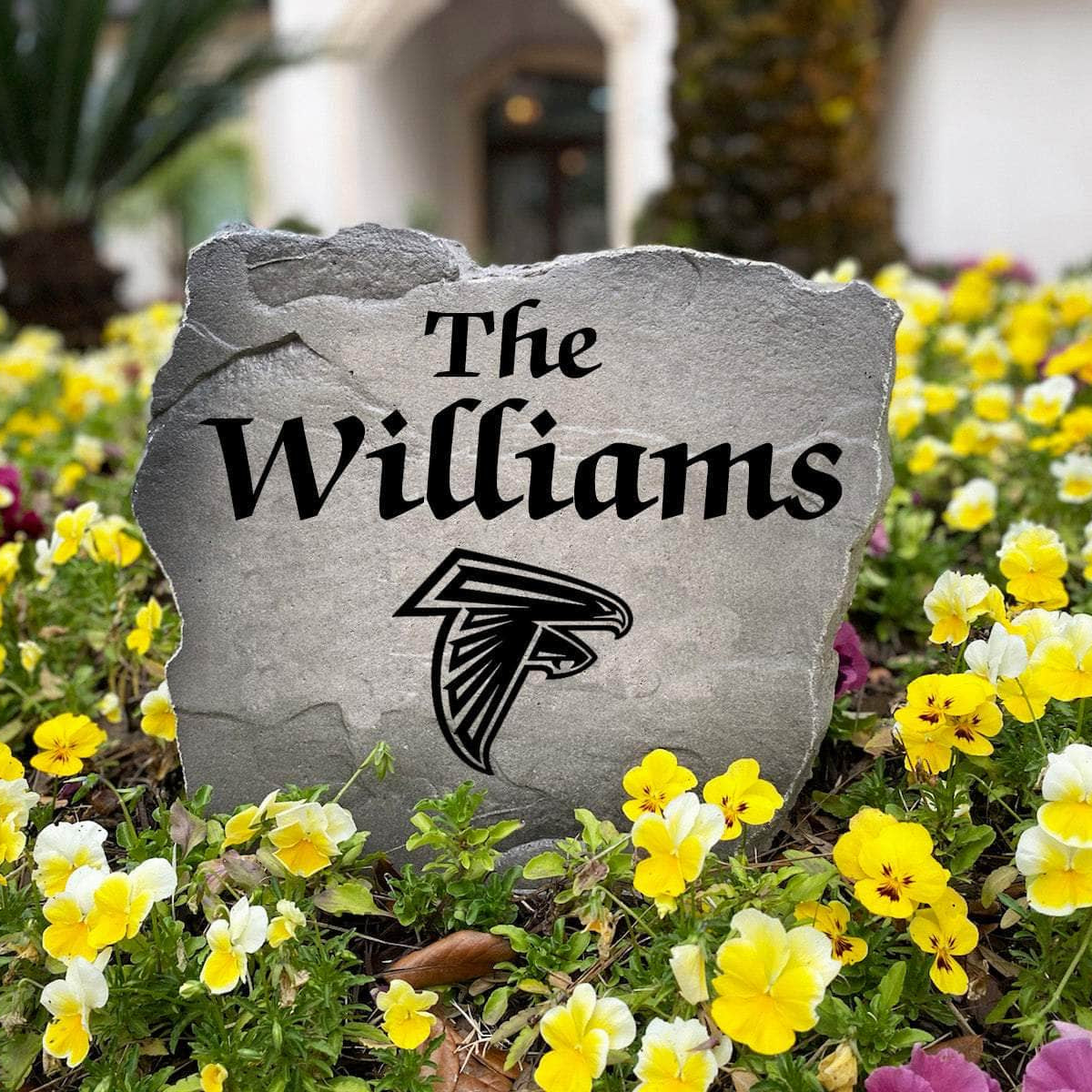 Personalized Atlanta Falcons outdoor name stone featuring custom family lettering permanently engraved into premium stone. A unique gift for football fans, housewarmings, birthdays, and new homeowners.