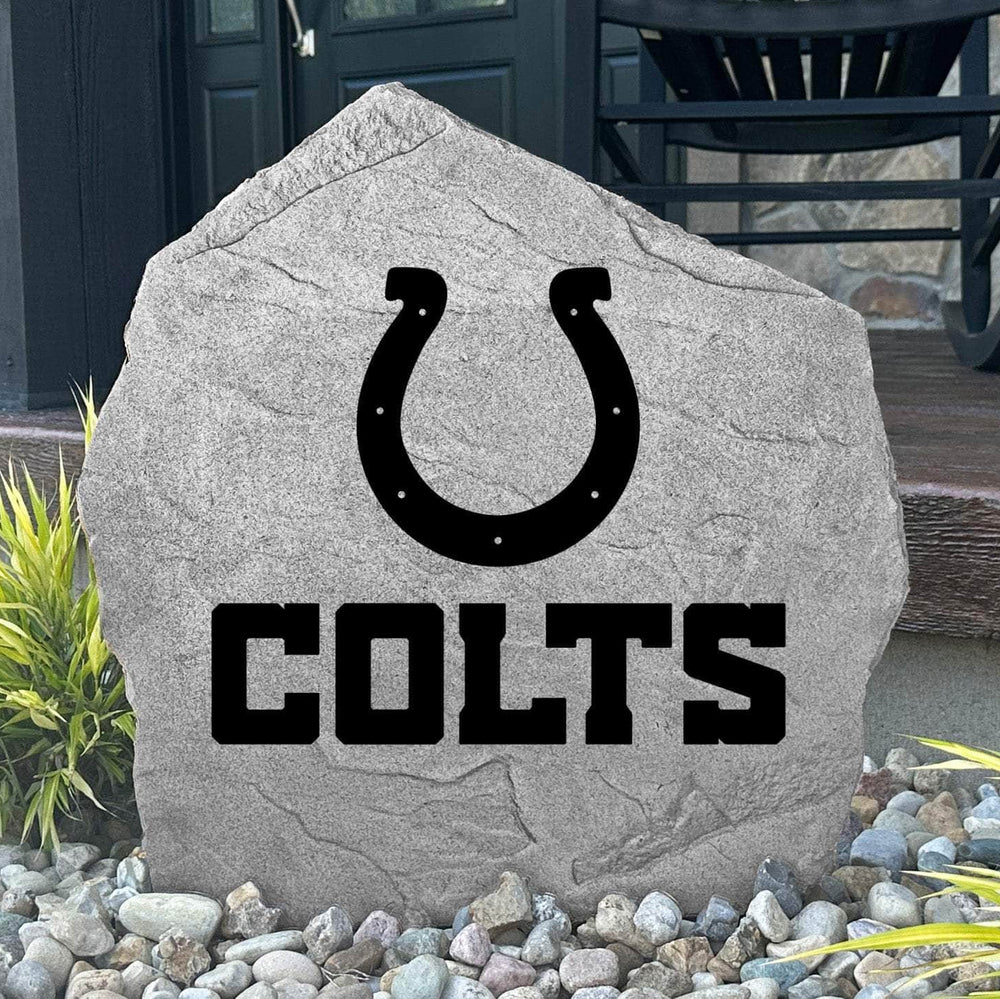 Custom Indianapolis Colts Logo Stone displayed in a landscaped flower bed, showcasing officially licensed team artwork permanently engraved into the stone. This outdoor accent creates a bold focal point for Colts fans and outdoor living spaces.