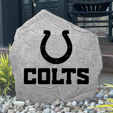Custom Indianapolis Colts Logo Stone displayed in a landscaped flower bed, showcasing officially licensed team artwork permanently engraved into the stone. This outdoor accent creates a bold focal point for Colts fans and outdoor living spaces.