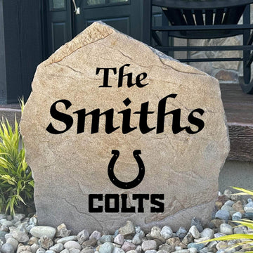 Officially licensed Indianapolis Colts Name Stone featuring a personalized family name and the iconic Indianapolis Colts logo engraved directly into the stone surface. This custom garden stone adds NFL team pride and curb appeal to front yards, patios, gardens, and entryways.
