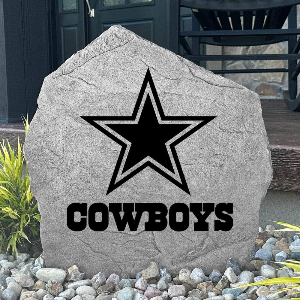 Custom Dallas Cowboys Logo Stone displayed in a landscaped flower bed, showcasing officially licensed team artwork permanently engraved into the stone. This outdoor accent creates a bold focal point for Cowboys fans and outdoor living spaces.