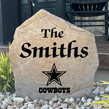 Officially licensed Dallas Cowboys Name Stone featuring a personalized family name and the iconic Dallas Cowboys logo engraved directly into the stone surface. This custom garden stone adds NFL team pride and curb appeal to front yards, patios, gardens, and entryways.