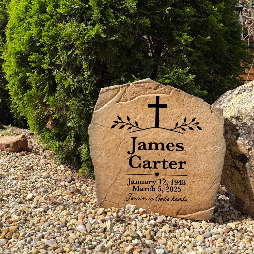 Personalized memorial stone with elegant cross engraving displayed in a garden, cemetery, or remembrance space
