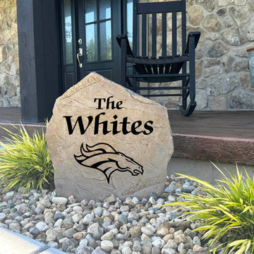 Decorative Denver Broncos Name Stone featuring personalized family names permanently engraved into the stone surface alongside officially licensed team graphics. Perfect for gardens, patios, and entryways, this outdoor accent celebrates Denver Broncos football tradition.