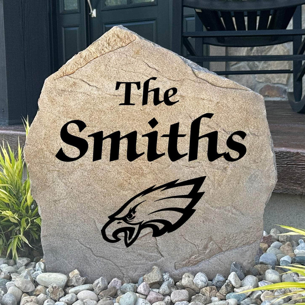 Officially licensed Philadelphia Eagles Name Stone featuring a personalized family name and the iconic Philadelphia Eagles logo engraved directly into the stone surface. This custom garden stone adds NFL team pride and curb appeal to front yards, patios, gardens, and entryways.