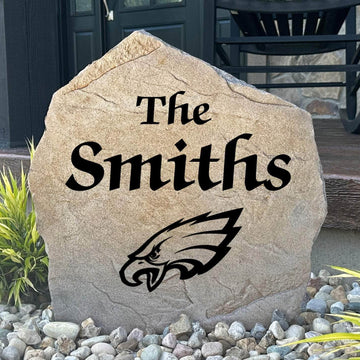 Officially licensed Philadelphia Eagles Name Stone featuring a personalized family name and the iconic Philadelphia Eagles logo engraved directly into the stone surface. This custom garden stone adds NFL team pride and curb appeal to front yards, patios, gardens, and entryways.