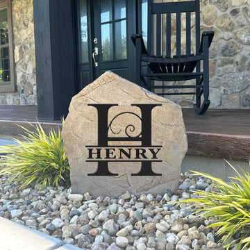 Handcrafted engraved Fancy Monogram monument combining graceful detailing with premium concrete construction for a striking landscape focal point.