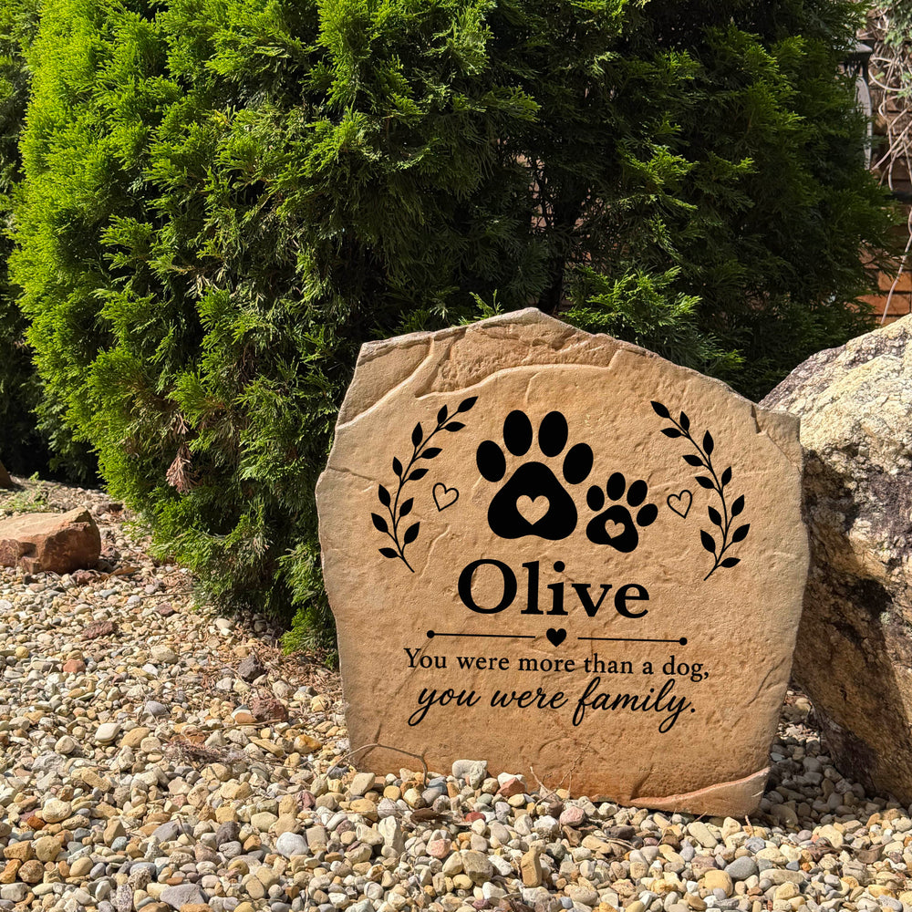 Outdoor pet memorial stone with a paw print design personalized with your pet's name and dates for lasting remembrance.