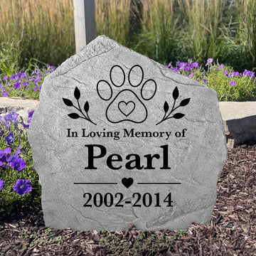 Custom engraved paw print memorial stone honoring the life and memory of a cherished dog or cat