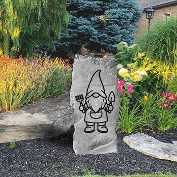 Perched beside a garden path and surrounded by colorful blooms, the Vertical Gnome Stone adds a whimsical touch with its cheerful engraved character and upright profile. Designed to stand out in flower beds and landscape borders, this playful accent brings personality, charm, and a sense of fun to any outdoor space.