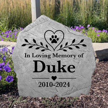Custom Heart & Paw pet memorial stone featuring an engraved paw print and heart design for outdoor remembrance