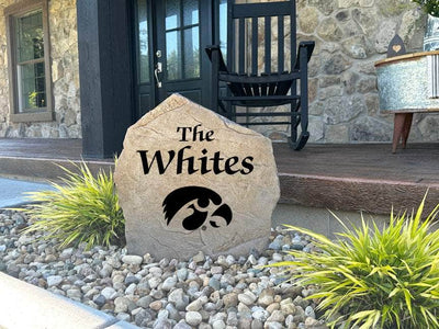 Decorative stone with Hawkeye logo and family surname