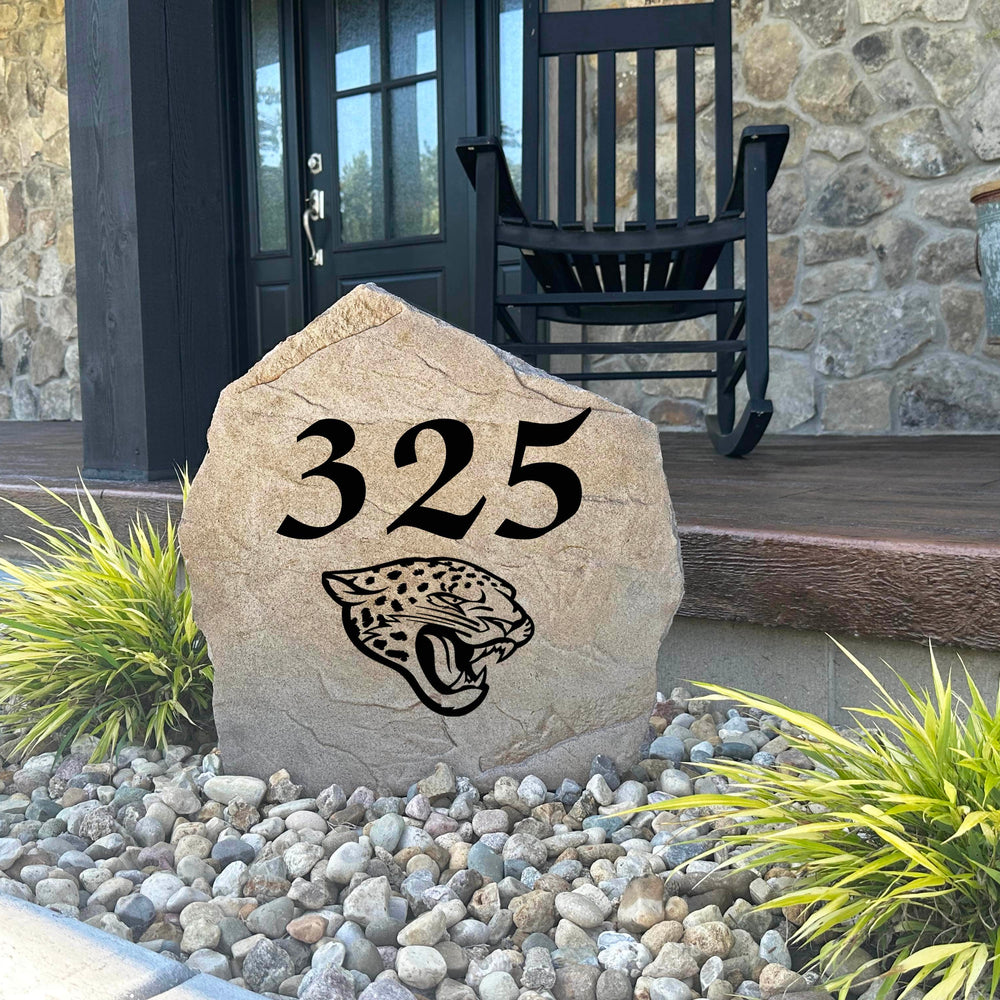 Decorative Jacksonville Jaguars Address Stone featuring personalized house numbers permanently engraved into the stone surface alongside officially licensed team graphics. Perfect for driveways, patios, gardens, and landscape beds, this address marker celebrates Jaguars football tradition.