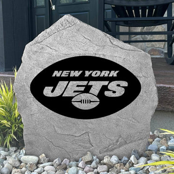 Custom New York Jets Logo Stone displayed in a landscaped flower bed, showcasing officially licensed team artwork permanently engraved into the stone. This outdoor accent creates a bold focal point for Jets fans and outdoor living spaces.