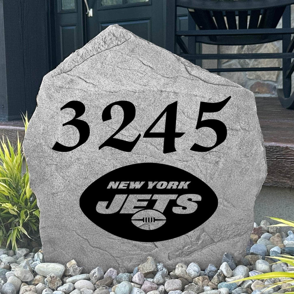Custom New York Jets Address Stone displayed in a landscaped flower bed with personalized house numbers and officially licensed team artwork. This engraved address marker creates a striking focal point for Jets fans and outdoor living spaces.
