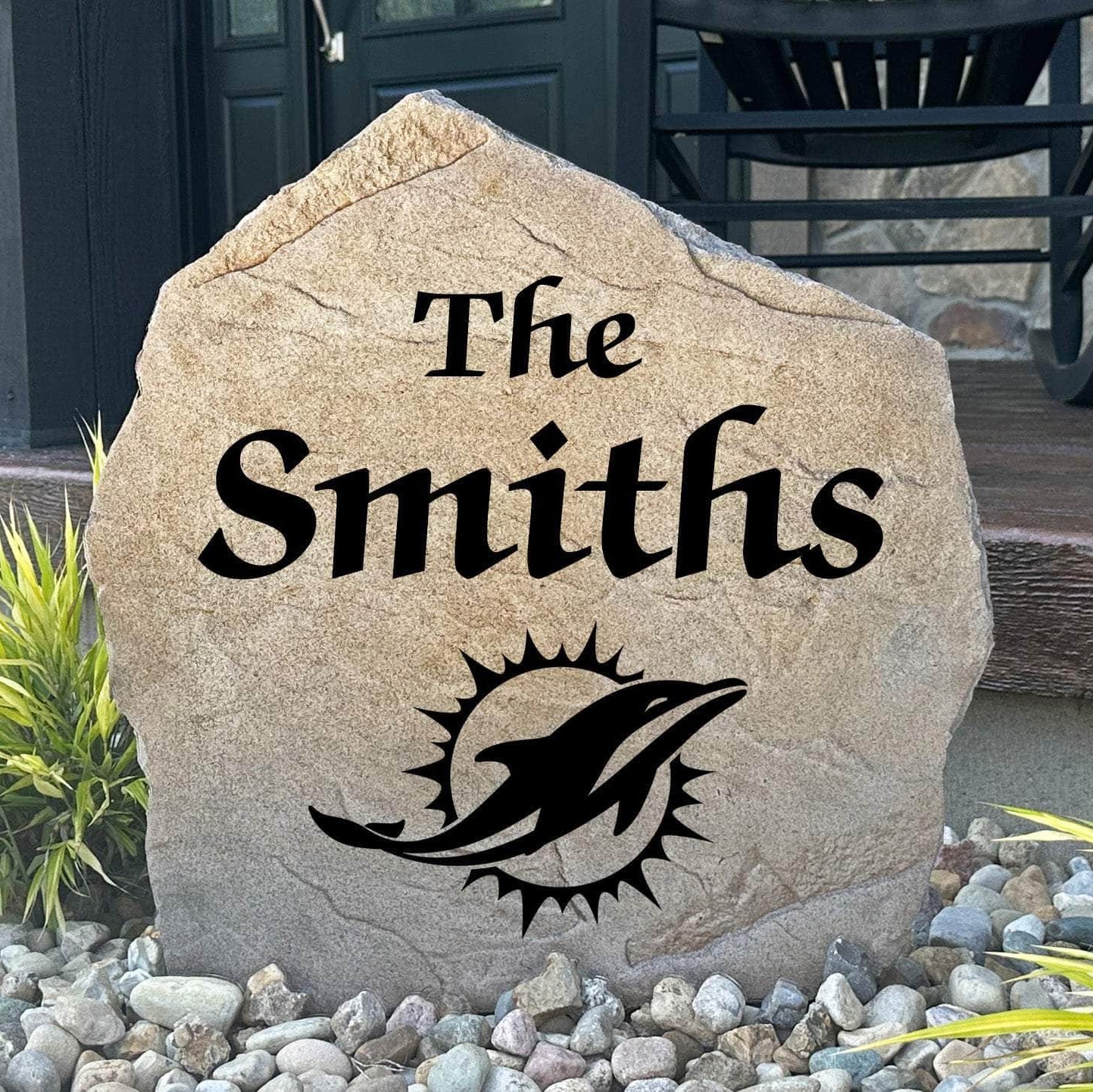 Officially licensed Miami Dolphins Name Stone featuring a personalized family name and the iconic Miami Dolphins logo engraved directly into the stone surface. This custom garden stone adds NFL team pride and curb appeal to front yards, patios, gardens, and entryways.