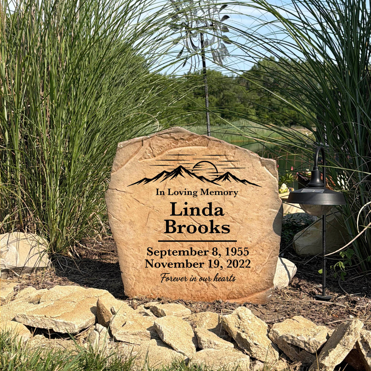 Weather-resistant Mountain View Memorial Stone with custom name and dates displayed in a serene outdoor setting