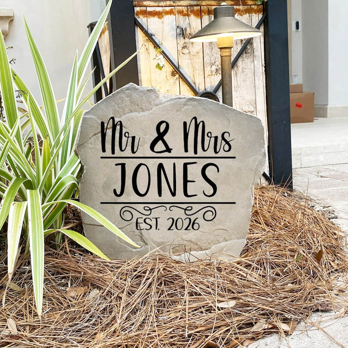 Decorative Mr. & Mrs. Name Stone featuring custom family names permanently engraved into the stone surface. Perfect as a wedding gift or housewarming gift, this personalized stone enhances entryways and landscape beds.