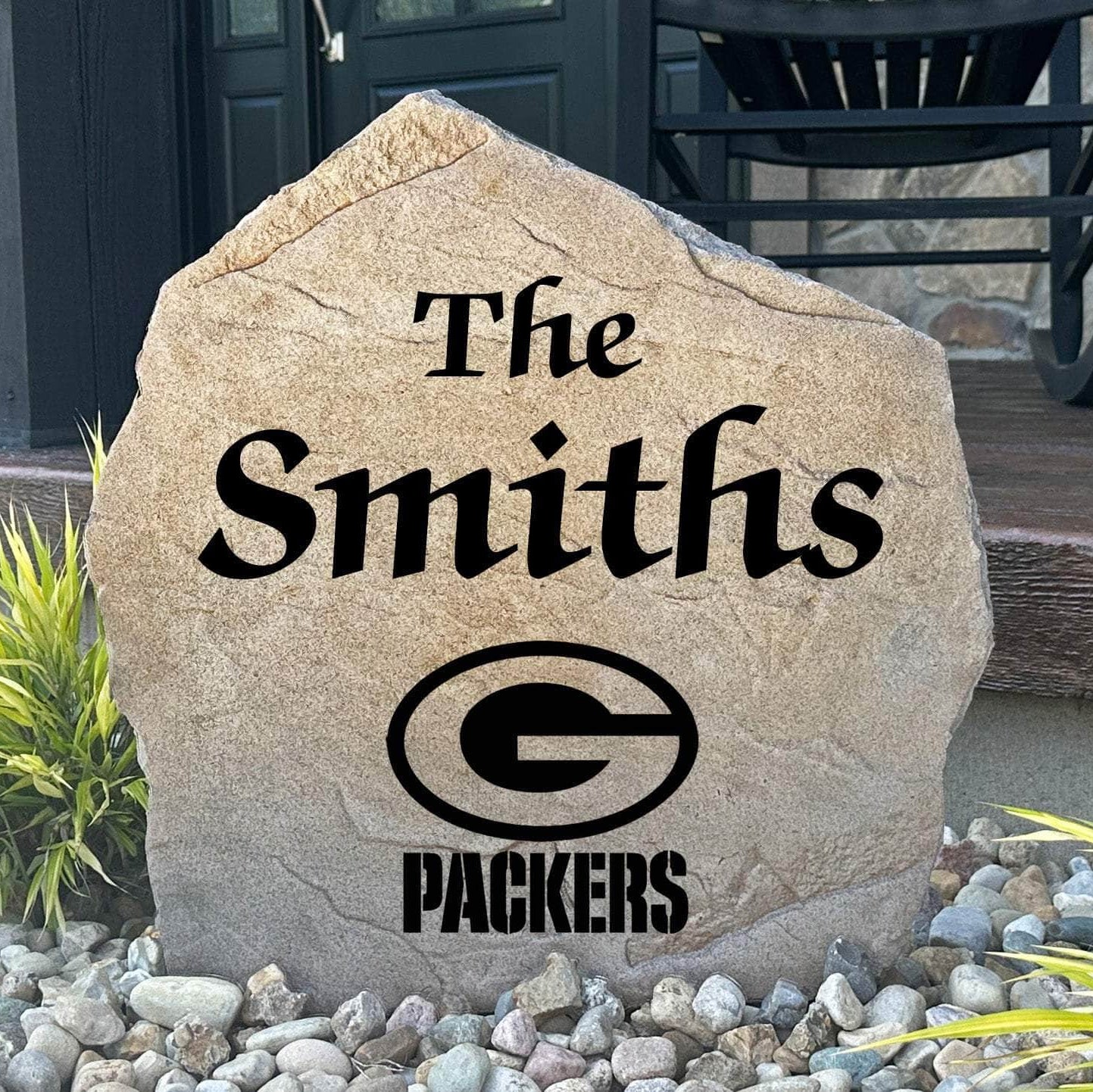 Officially licensed Green Bay Packers Name Stone featuring a personalized family name and the iconic Green Bay Packers logo engraved directly into the stone surface. This custom garden stone adds NFL team pride and curb appeal to front yards, patios, gardens, and entryways.