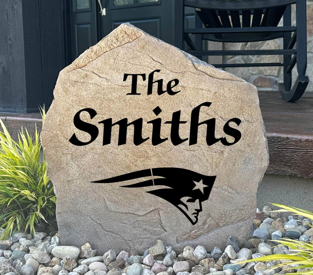 Officially licensed New England Patriots Name Stone featuring a personalized family name and the iconic New England Patriots logo engraved directly into the stone surface. This custom garden stone adds NFL team pride and curb appeal to front yards, patios, gardens, and entryways.