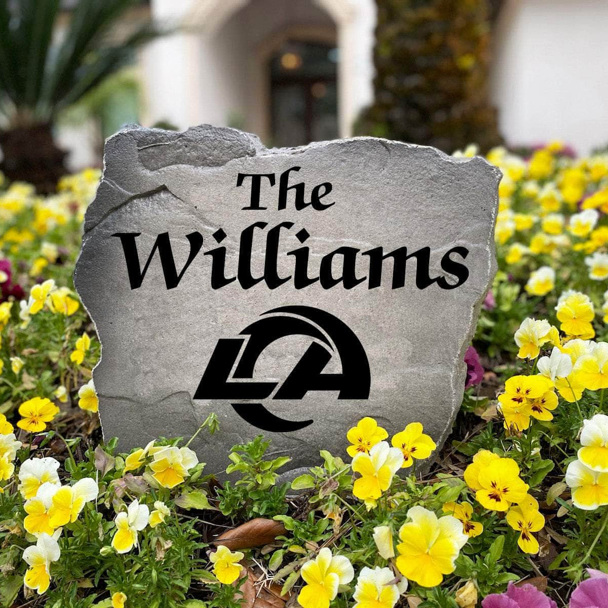 Officially licensed Los Angeles Rams Name Stone handcrafted in the USA with custom family engraving and durable team artwork. This decorative garden stone enhances landscape beds, patios, and outdoor living spaces with lasting beauty and NFL team pride.