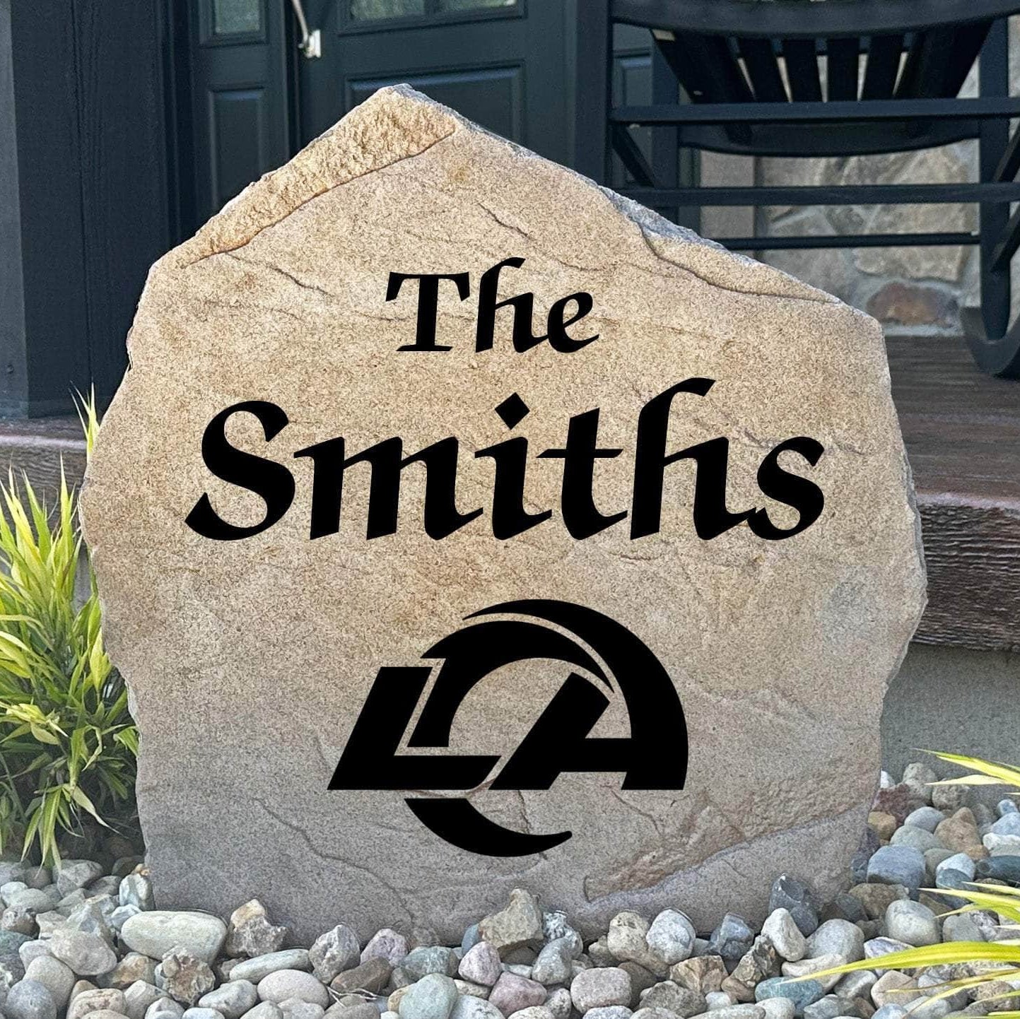 Officially licensed Los Angeles Rams Name Stone featuring a personalized family name and the iconic Los Angeles Rams logo engraved directly into the stone surface. This custom garden stone adds NFL team pride and curb appeal to front yards, patios, gardens, and entryways.