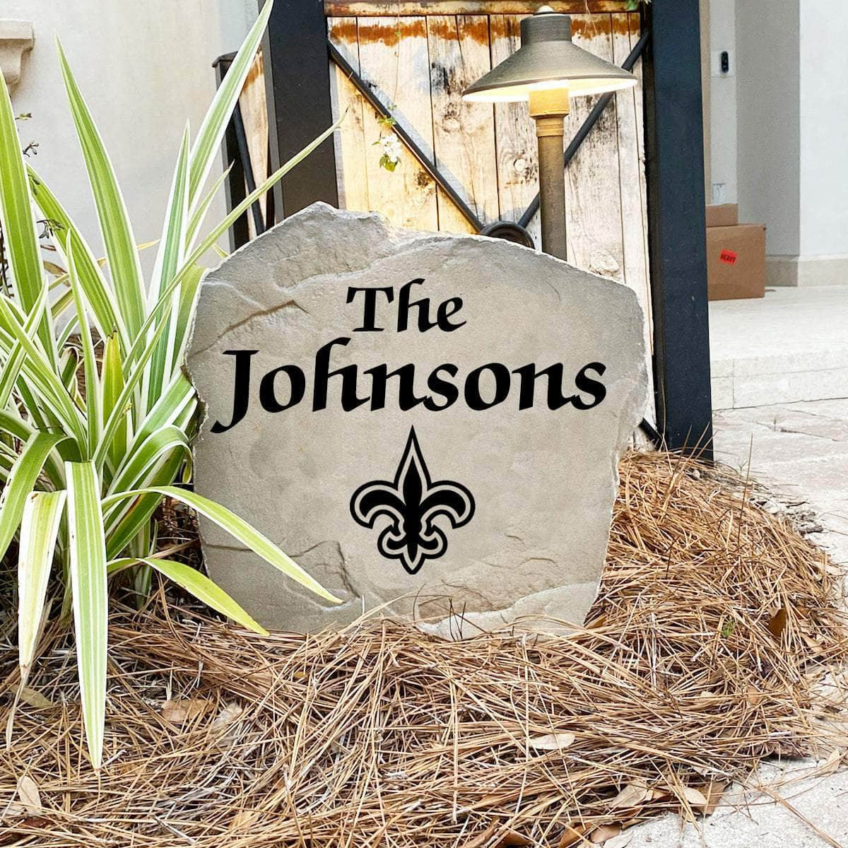 Engraved New Orleans Saints Name Stone with a custom family name and the official New Orleans Saints logo, bringing football spirit and timeless style to front yard landscapes, walkways, and home entrances.
