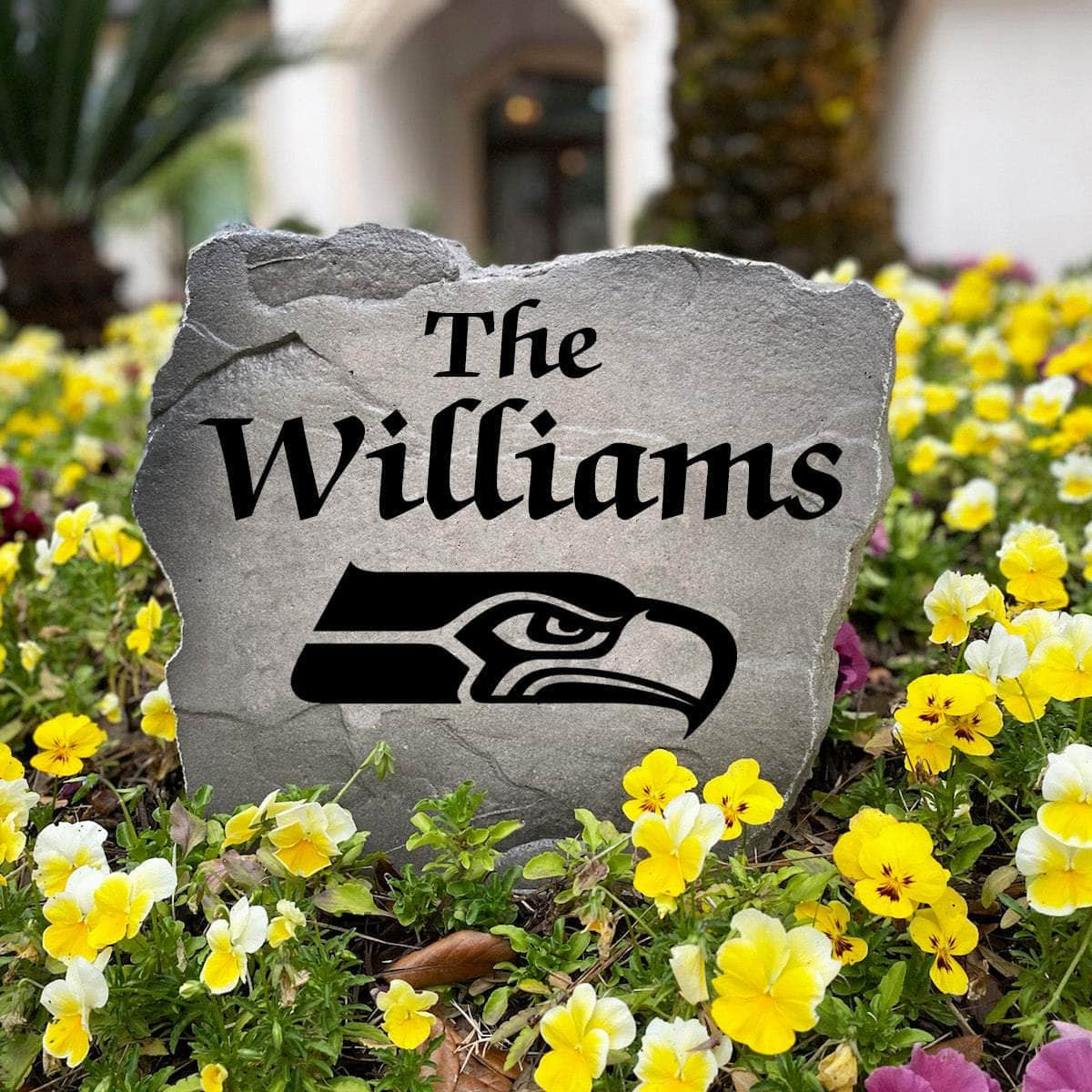 Officially licensed Seattle Seahawks Name Stone handcrafted in the USA with custom family engraving and durable team artwork. This decorative garden stone enhances landscape beds, patios, and outdoor living spaces with lasting beauty and NFL team pride.