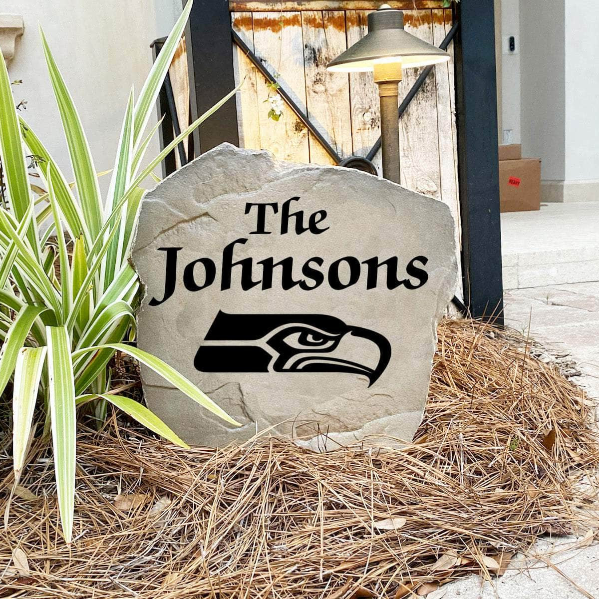 Engraved Seattle Seahawks Name Stone with a custom family name and the official Seattle Seahawks logo, bringing football spirit and timeless style to front yard landscapes, walkways, and home entrances.