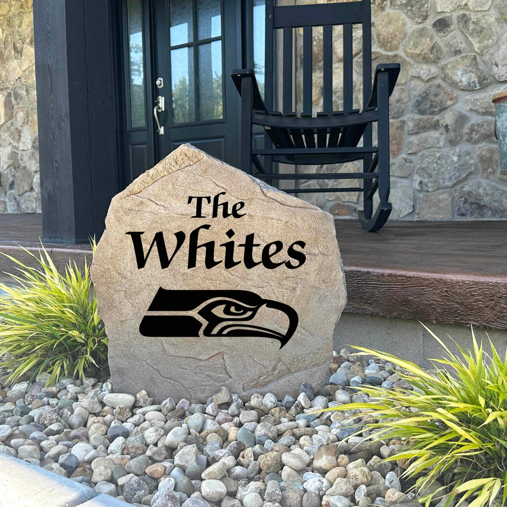 Decorative Seattle Seahawks Name Stone featuring personalized family names permanently engraved into the stone surface alongside officially licensed team graphics. Perfect for gardens, patios, and entryways, this outdoor accent celebrates Seahawks football tradition.