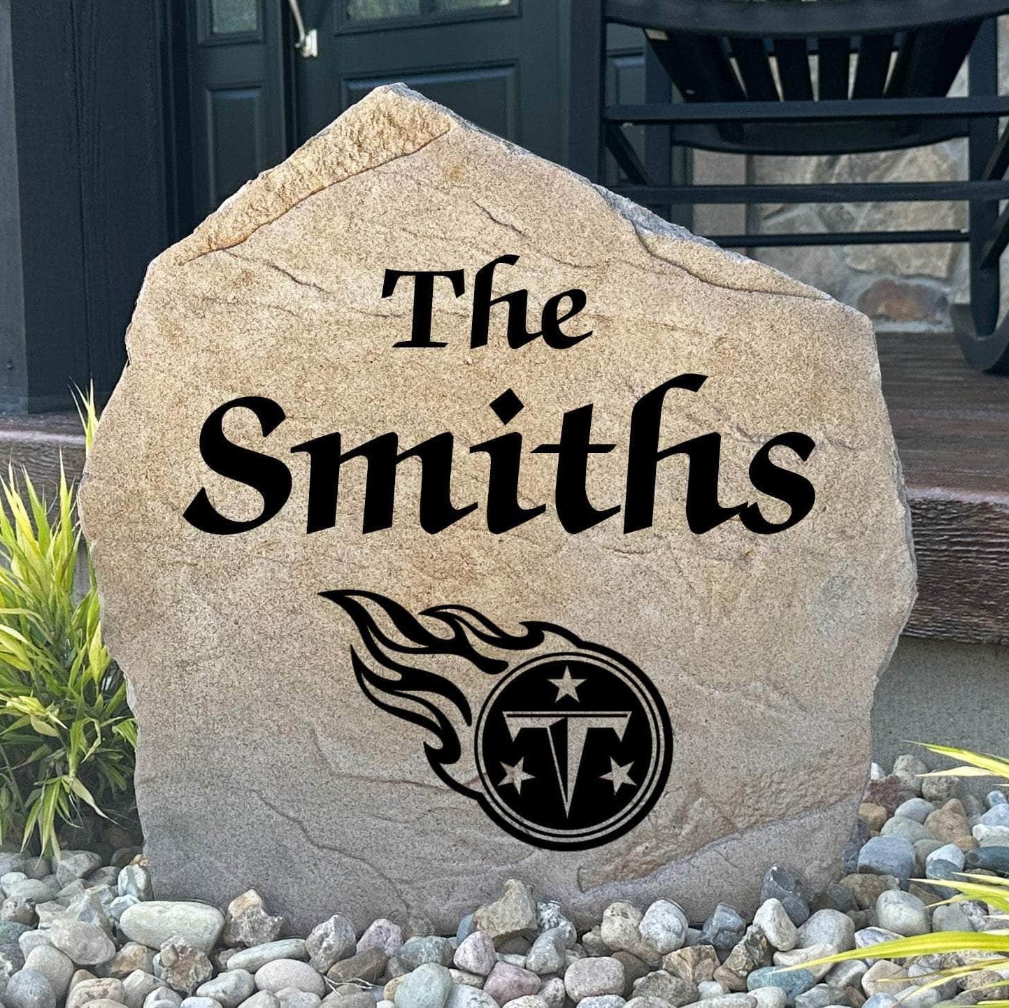 Officially licensed Tennessee Titans Name Stone featuring a personalized family name and the iconic Tennessee Titans logo engraved directly into the stone surface. This custom garden stone adds NFL team pride and curb appeal to front yards, patios, gardens, and entryways.
