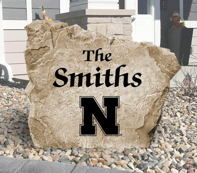 Personalized University of Nebraska name rock for outdoor decor and gifting.