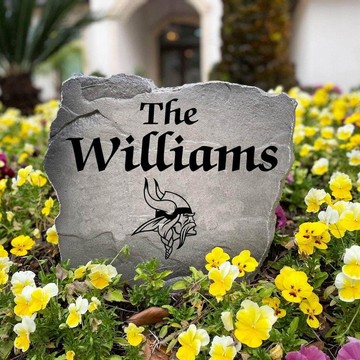 Officially licensed Minnesota Vikings Name Stone handcrafted in the USA with custom family engraving and durable team artwork. This decorative garden stone enhances landscape beds, patios, and outdoor living spaces with lasting beauty and NFL team pride.