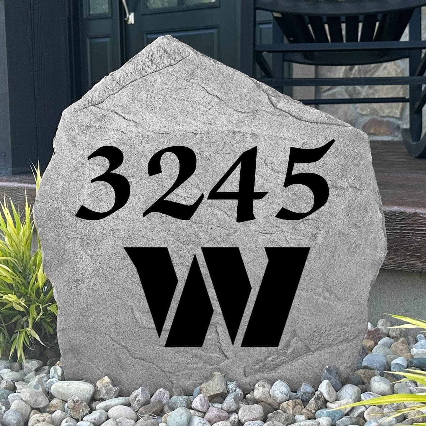 Custom Washington Commanders Address Stone displayed in a landscaped flower bed with personalized house numbers and officially licensed team artwork. This engraved address marker creates a striking focal point for football fans and outdoor living spaces.