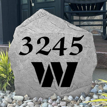 Custom Washington Commanders Address Stone displayed in a landscaped flower bed with personalized house numbers and officially licensed team artwork. This engraved address marker creates a striking focal point for football fans and outdoor living spaces.
