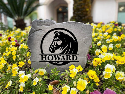 Decorative name stone for farm or ranch entrance with horse design