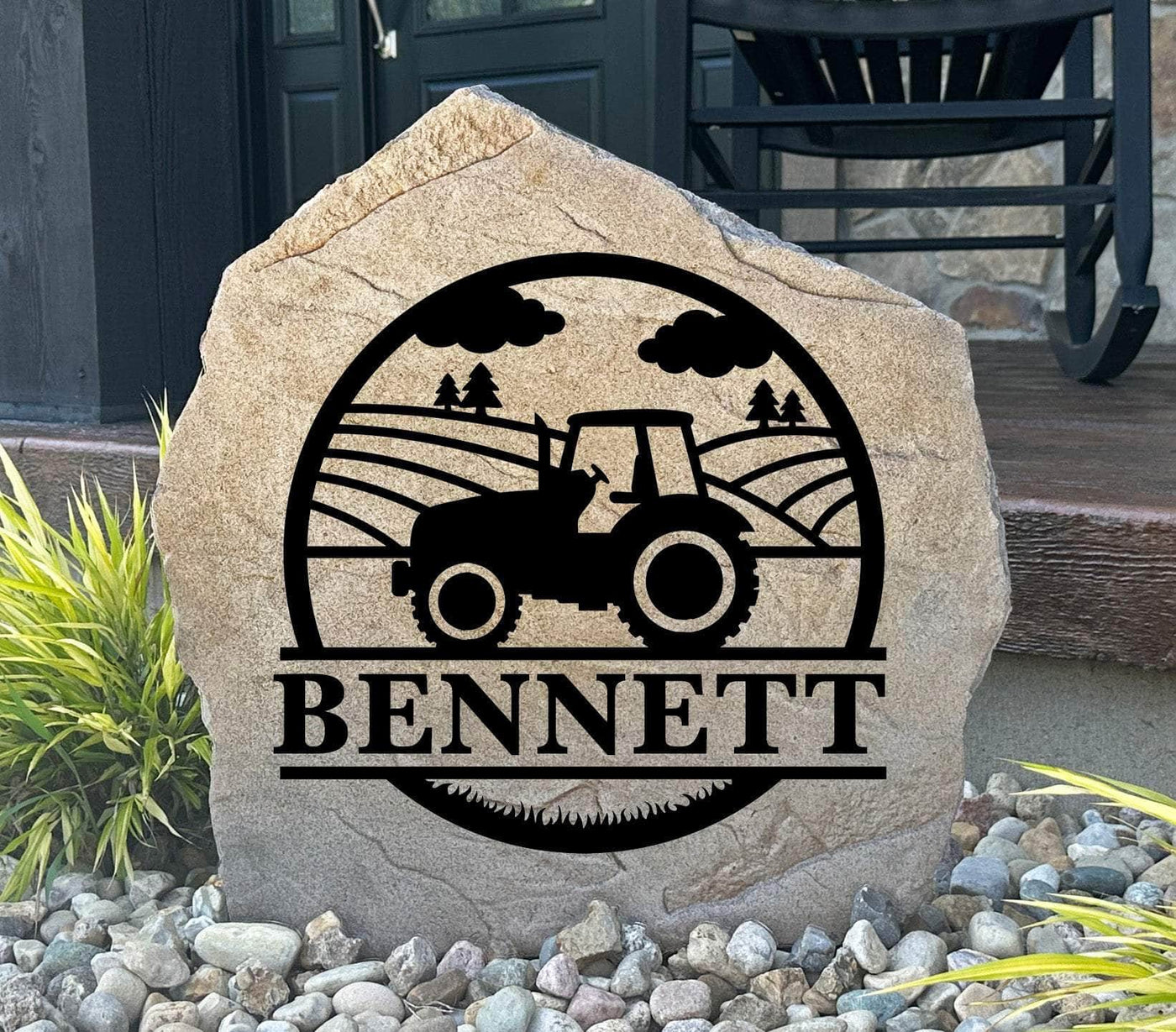 Rustic farm monogram stone featuring a tractor and family name, ideal for garden décor.