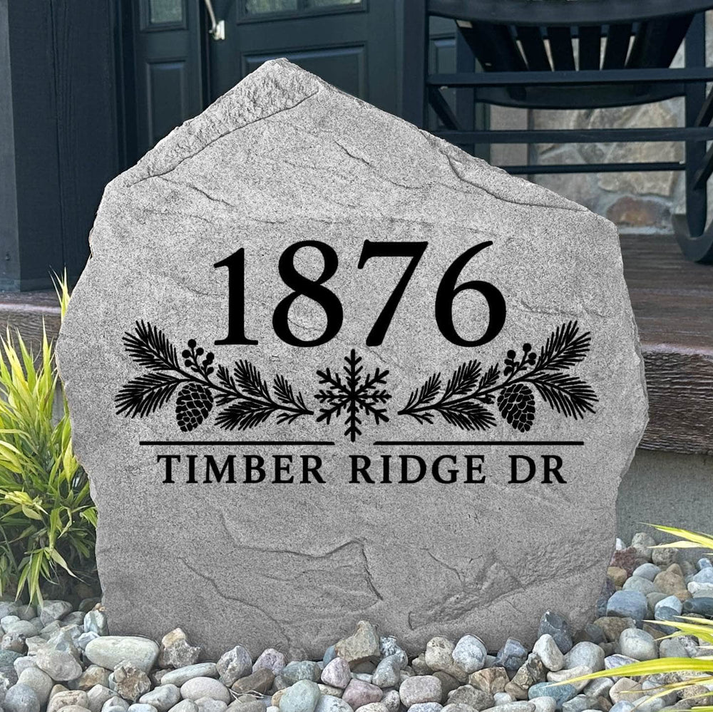Gray Winter Address Stone engraved 1876 Timber Ridge Dr with pinecones and a snowflake by a black front door