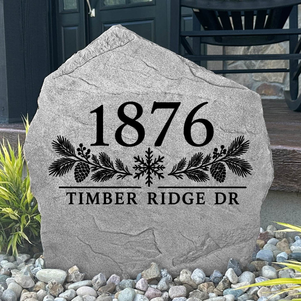 Gray Winter Address Stone engraved 1876 Timber Ridge Dr with pinecones and a snowflake by a black front door