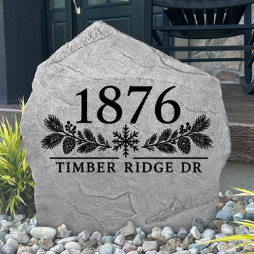 Gray Winter Address Stone engraved 1876 Timber Ridge Dr with pinecones and a snowflake by a black front door