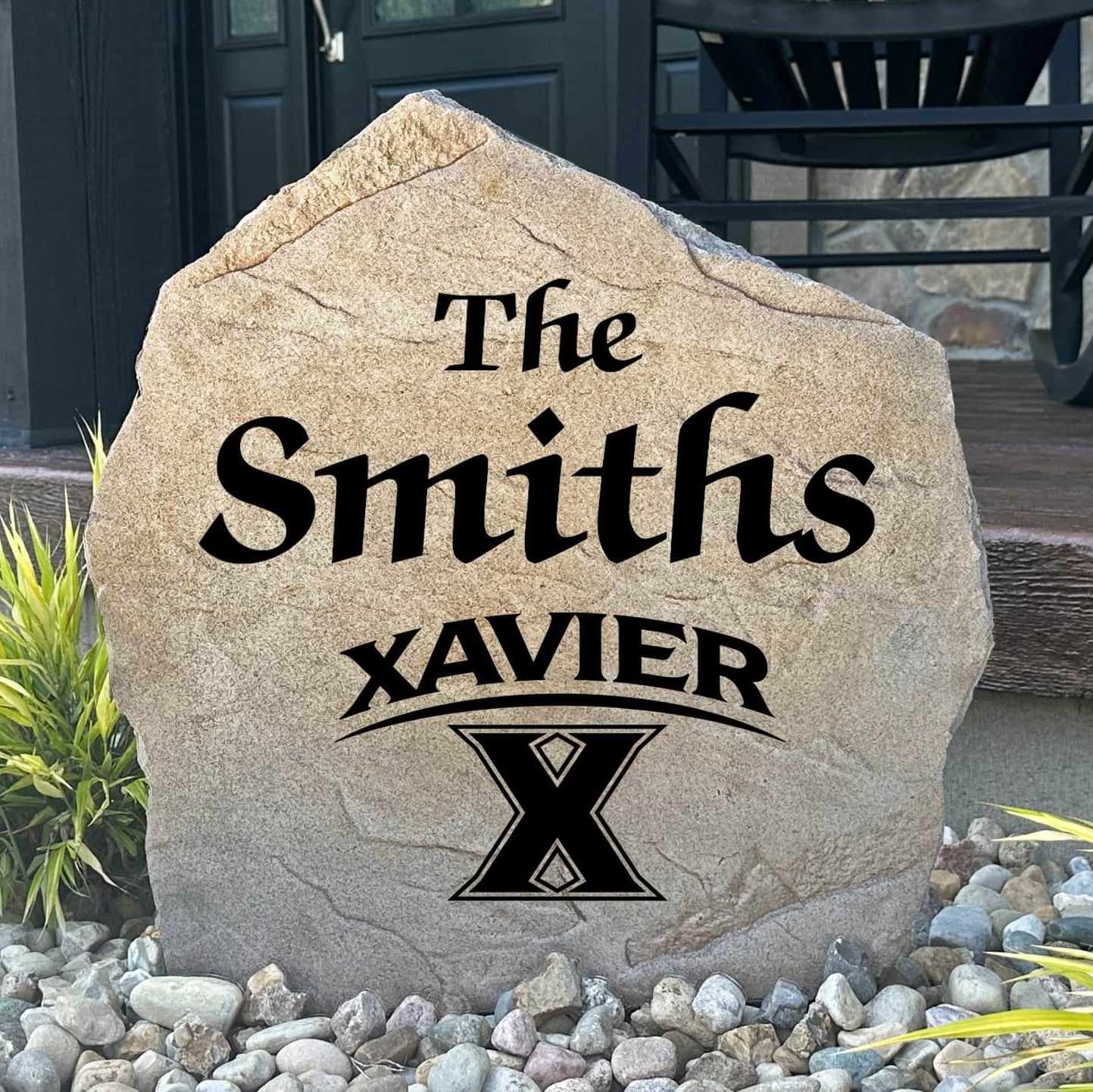 Personalized Xavier University Name Stone engraved with your family surname, creating a distinguished Musketeers-inspired centerpiece for your home's landscape.