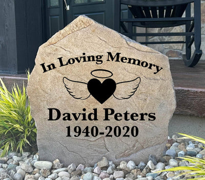 Angel wings and heart memorial stone engraved with "In Loving Memory"