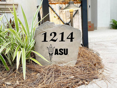 Outdoor rock featuring engraved address and Arizona State University logo