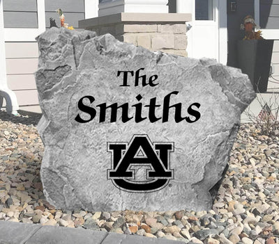 Outdoor landscaping rock with Auburn University logo and name