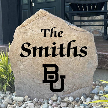 Officially licensed Baylor University Name Stone featuring a personalized family name and the iconic Baylor Bears logo engraved directly into the stone surface. This custom engraved garden stone adds school pride and curb appeal to front yards, patios, gardens, and entryways.