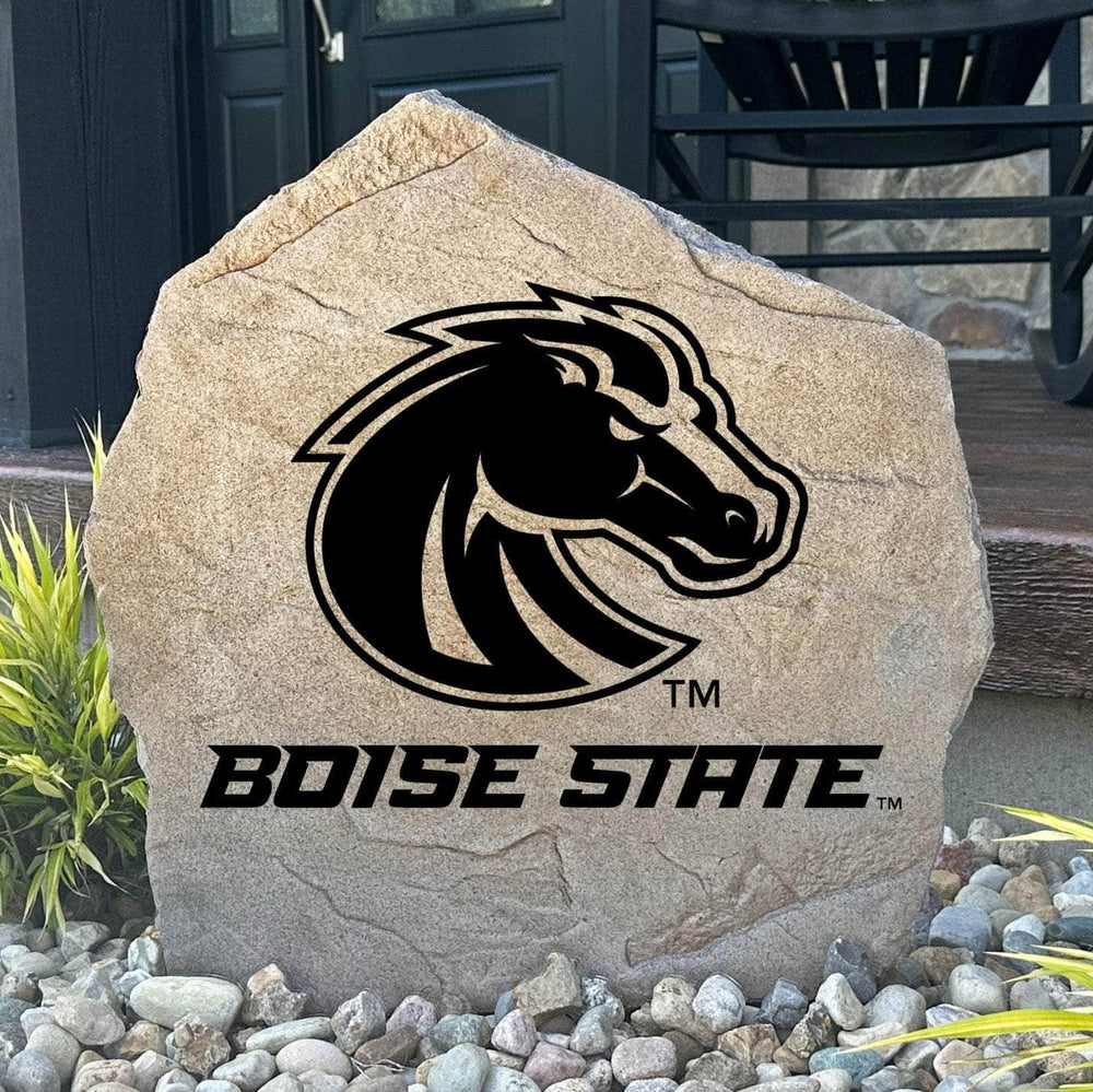 Custom Boise State Broncos Logo Stone displayed in a landscaped flower bed, showcasing officially licensed team artwork permanently engraved into the stone. This outdoor accent creates a beautiful focal point for alumni homes and devoted Broncos fans.