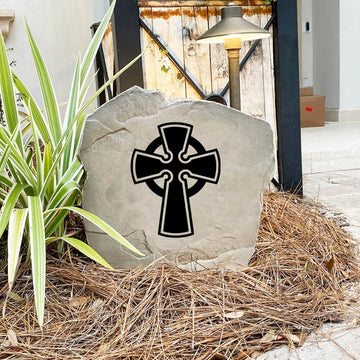 Celtic Cross Stone nestled among colorful flowers and natural greenery, bringing traditional Irish-inspired beauty and spiritual meaning to the landscape. Its weather-resistant design provides lasting charm for outdoor spaces.