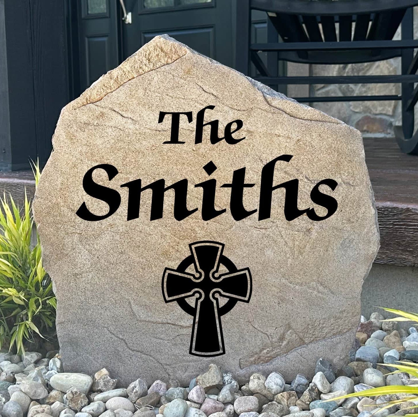 Personalized Celtic Cross Name Stone featuring custom family lettering and an elegant Celtic cross engraved directly into the stone surface. This decorative garden stone adds timeless beauty to front yards, patios, entryways, and landscape beds.
