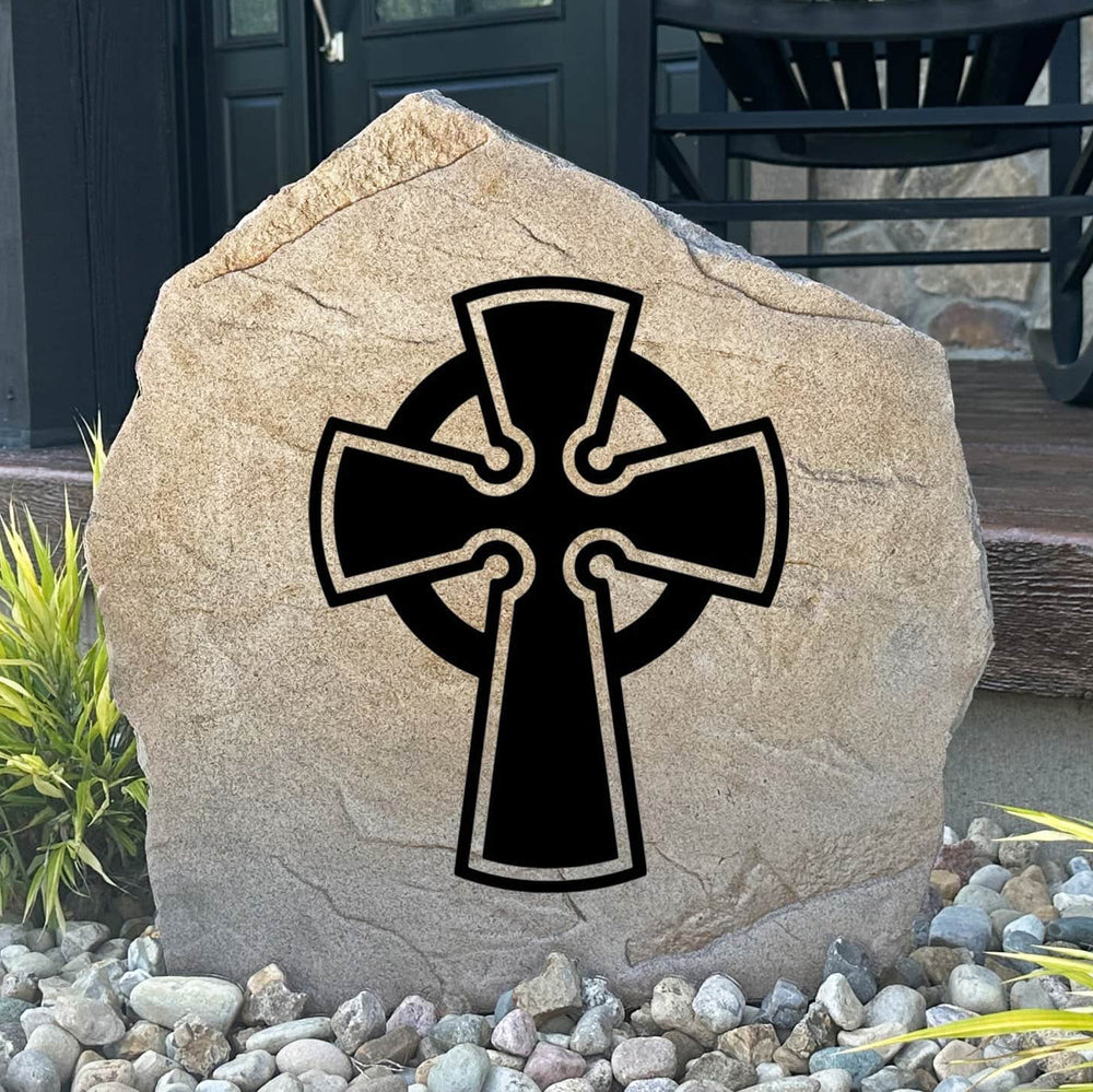 Engraved Celtic Cross Stone featuring a beautifully detailed Celtic cross design carved directly into the stone surface. This decorative garden stone adds timeless elegance and meaningful symbolism to front yards, gardens, patios, and memorial spaces.